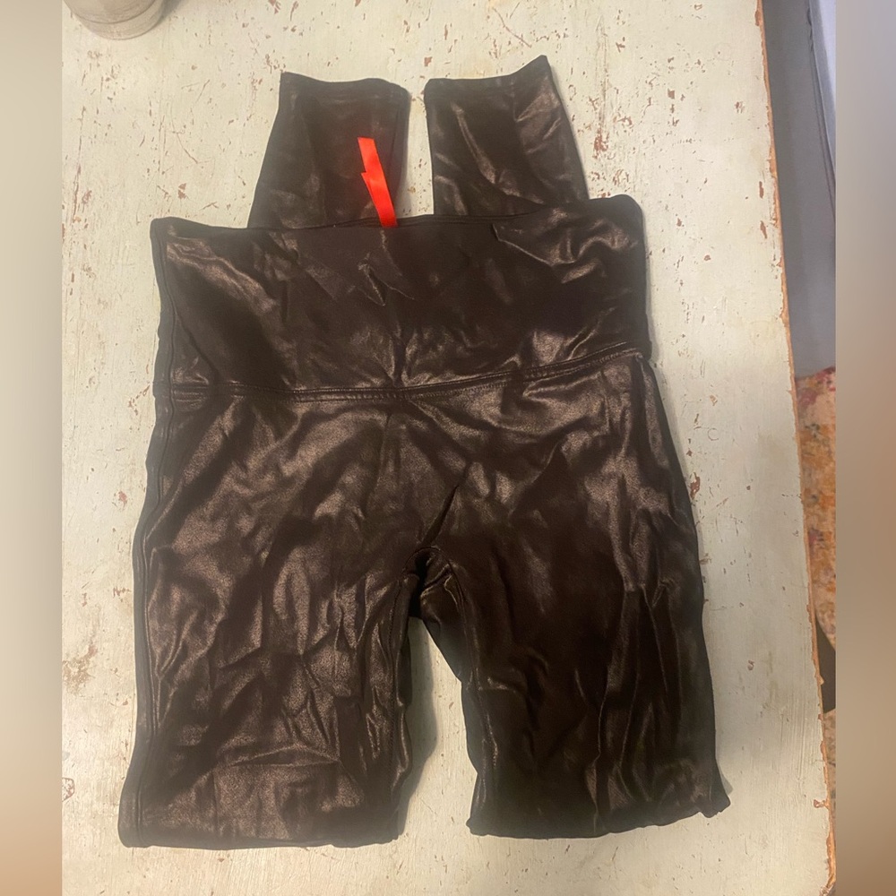 Women’s size medium Spanx faux leather leggings. Great condition.